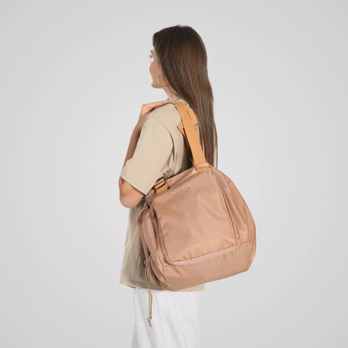 Woman carrying the project bag over her shoulder
